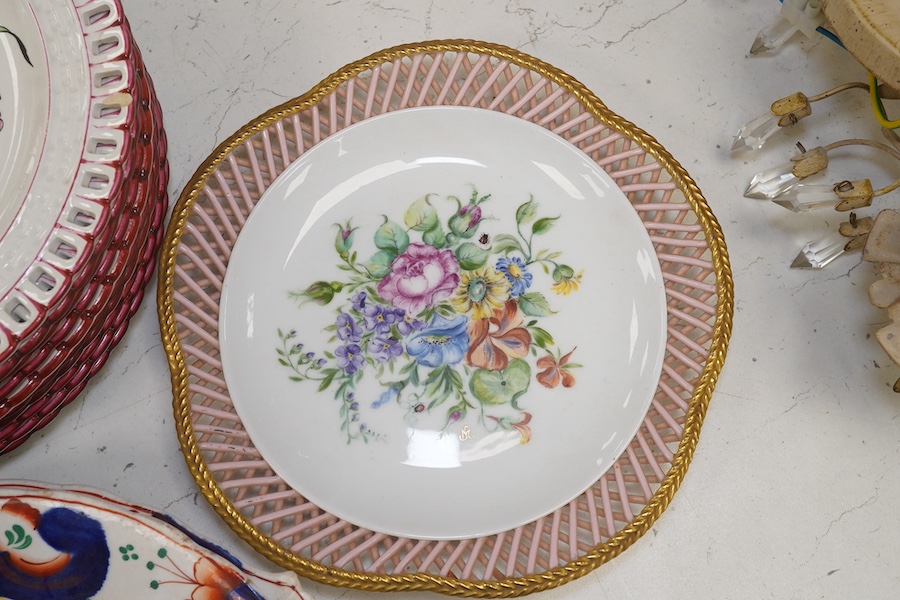 Ten French Luneville floral plates, a hand painted basket edged plate and various part dinner service plates, 24cm in diameter. Condition - mostly fair to good